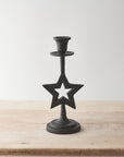 Candelabro de metal con estrella