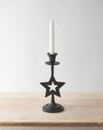 Candelabro de metal con estrella